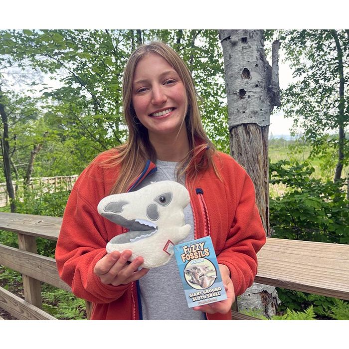 Ground Sloth plush in hand