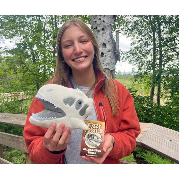 Allosaurus plush in hand