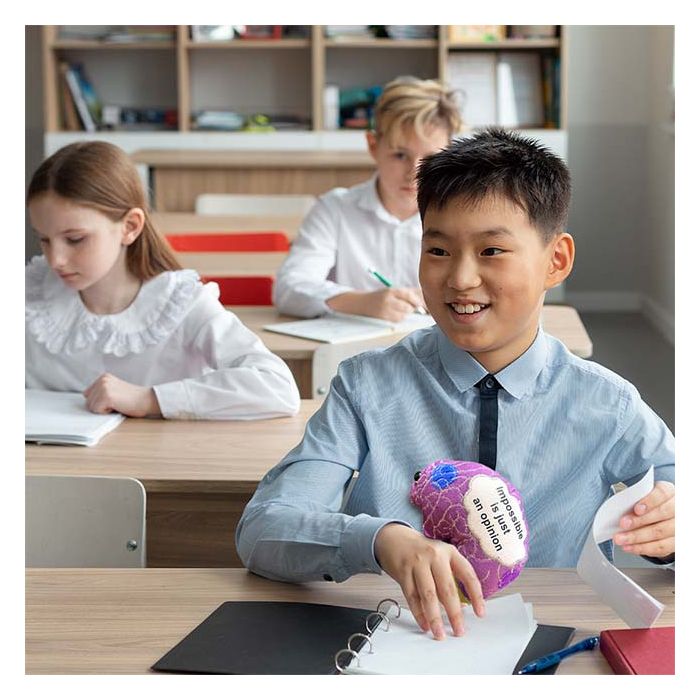 Student holding Dyslexia plush