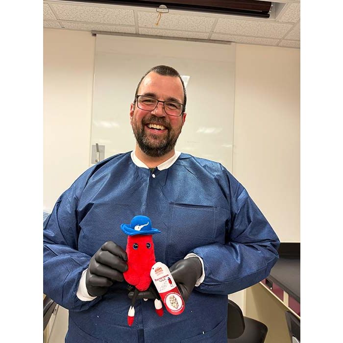 Testosterone plush with lab tech