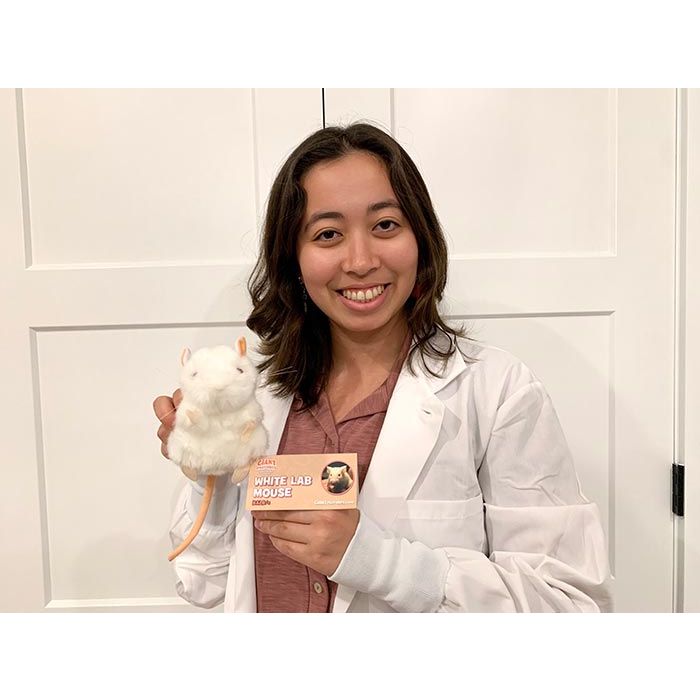 White Lab Mouse with woman in lab coat